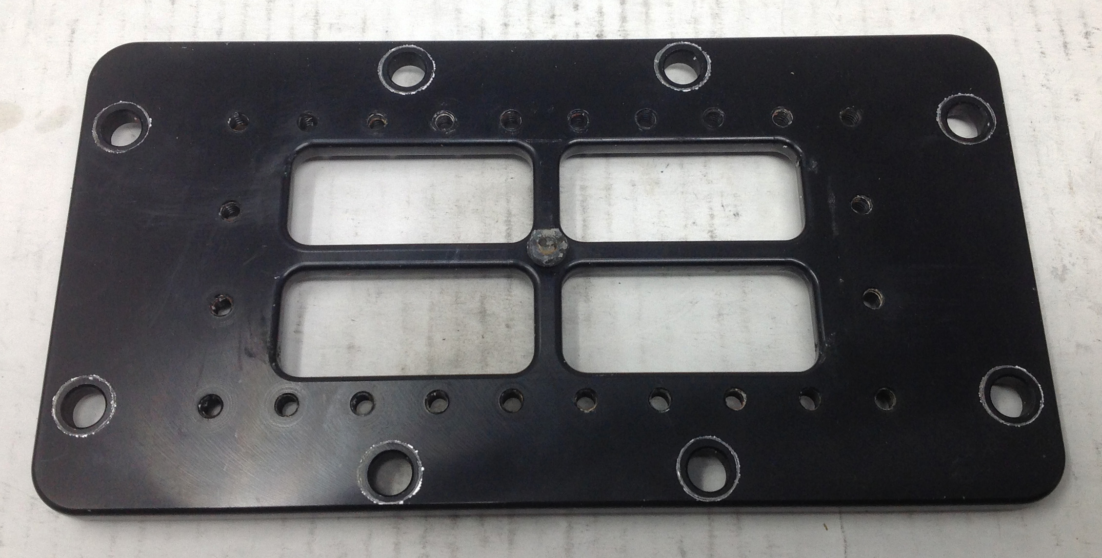 Burst Panel Manifold Adapter Plate. Black Anodized.Dims: 8.5 x 4.5in